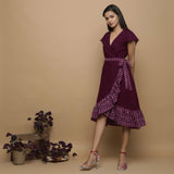 Left View of a Model wearing Maroon Handspun Cotton Asymmetrical Midi Wrap Dress