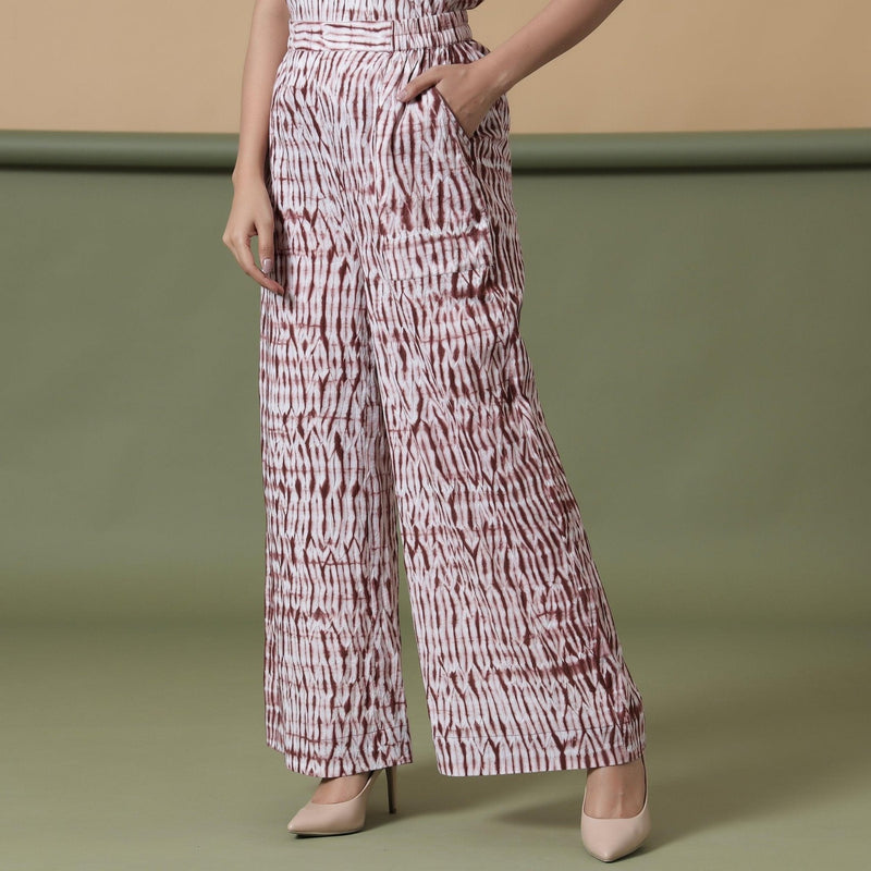 Left View of a Model wearing Maroon Shibori Tie-Dye Cotton Elasticated Wide Legged Pant