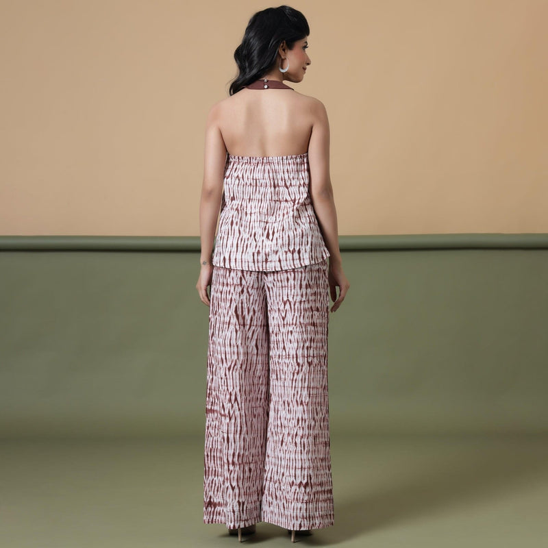 Back View of a Model wearing Maroon Shibori Tie-Dye Cotton Halter Neck Flared Top