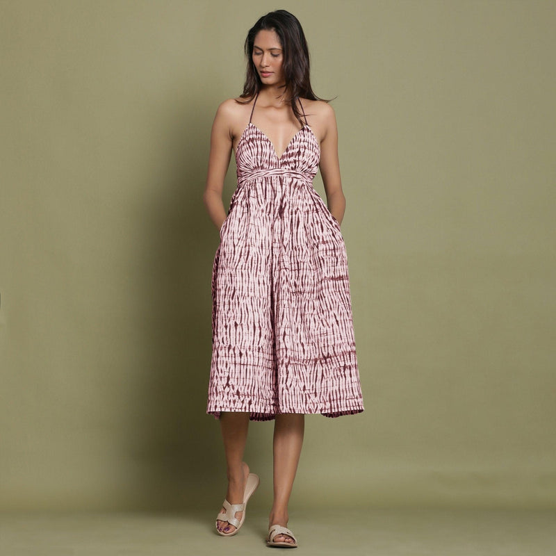 Front View of a Model wearing Maroon Shibori Halter Neck Gathered Dress