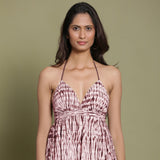 Front View of a Model wearing Maroon Shibori Halter Neck Gathered Dress