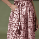 Front Detail of a Model wearing Maroon Shibori Drop Shoulder Dress