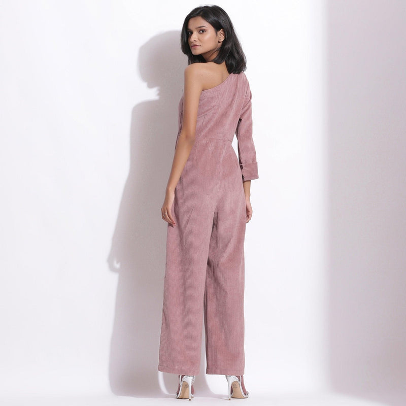 Back View of a Model wearing Mauve Corduroy One-Shoulder Jumpsuit