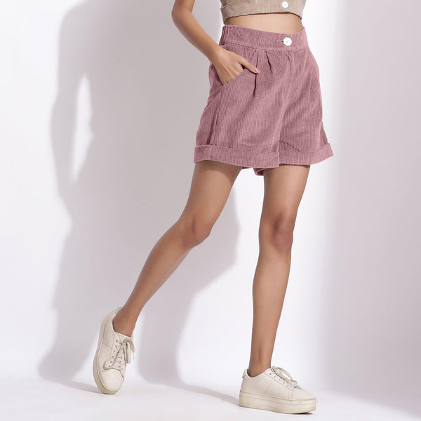 Right View of a Model wearing Mauve Cotton Corduroy Baggy Shorts