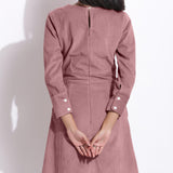 Back Detail of a Model wearing Cotton Corduroy Mauve Surplice Dress