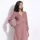 Right View of a Model wearing Cotton Corduroy Mauve Surplice Dress