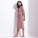 Left View of a Model wearing Cotton Corduroy Mauve Surplice Dress