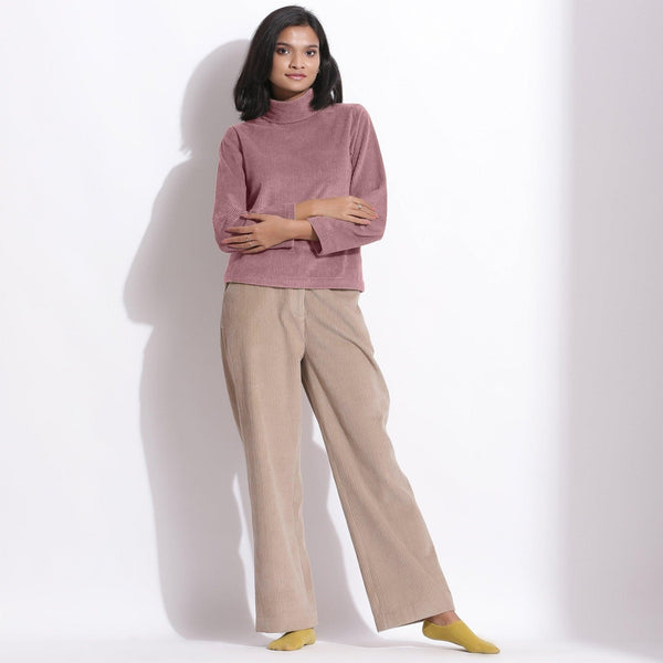 Front View of a Model wearing Mauve Corduroy High Neck Top