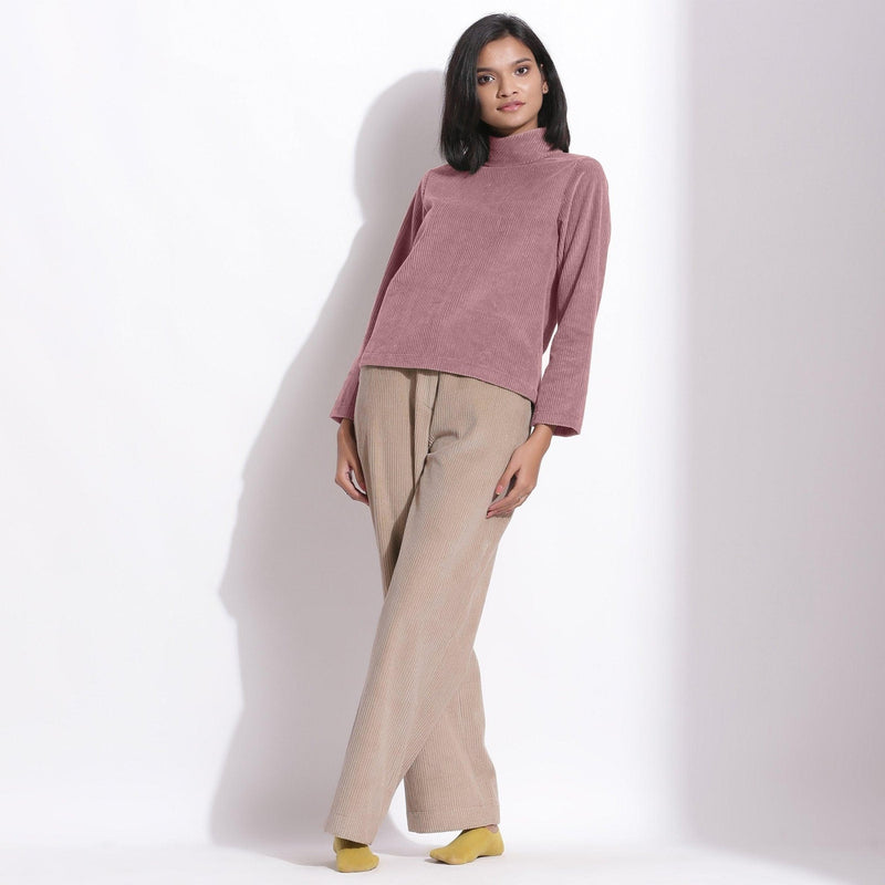 Front View of a Model wearing Mauve Corduroy High Neck Top