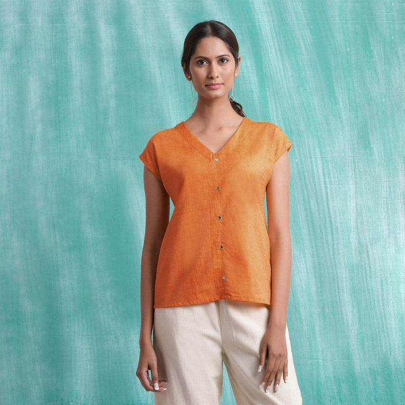 Front View of a Model wearing Melon Orange Mirror Work Drop Shoulder Top