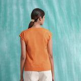 Back View of a Model wearing Melon Orange Mirror Work Drop Shoulder Top