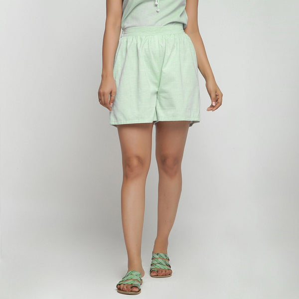 Front View of a Model wearing Mint Green Cotton Chambray Shorts