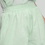 Front Detail of a Model wearing Mint Green Cotton Chambray Shorts