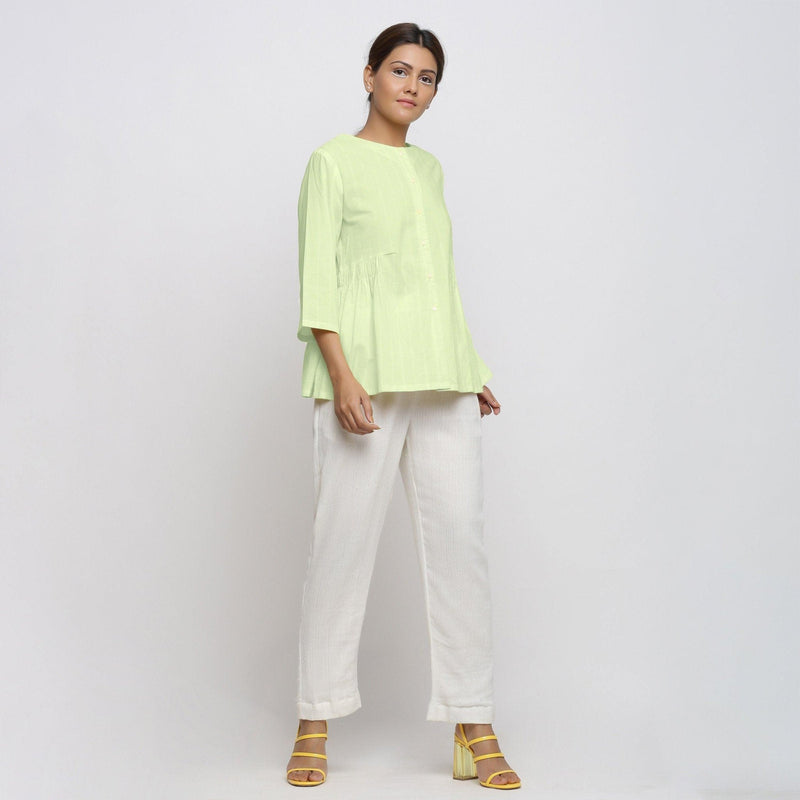 Right View of a Model wearing Mint Green Cotton Button-Down Top