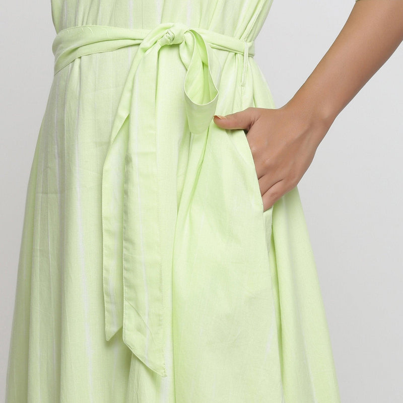 Left Detail of a Model wearing Mint Green Tie and Dye Tiered Dress