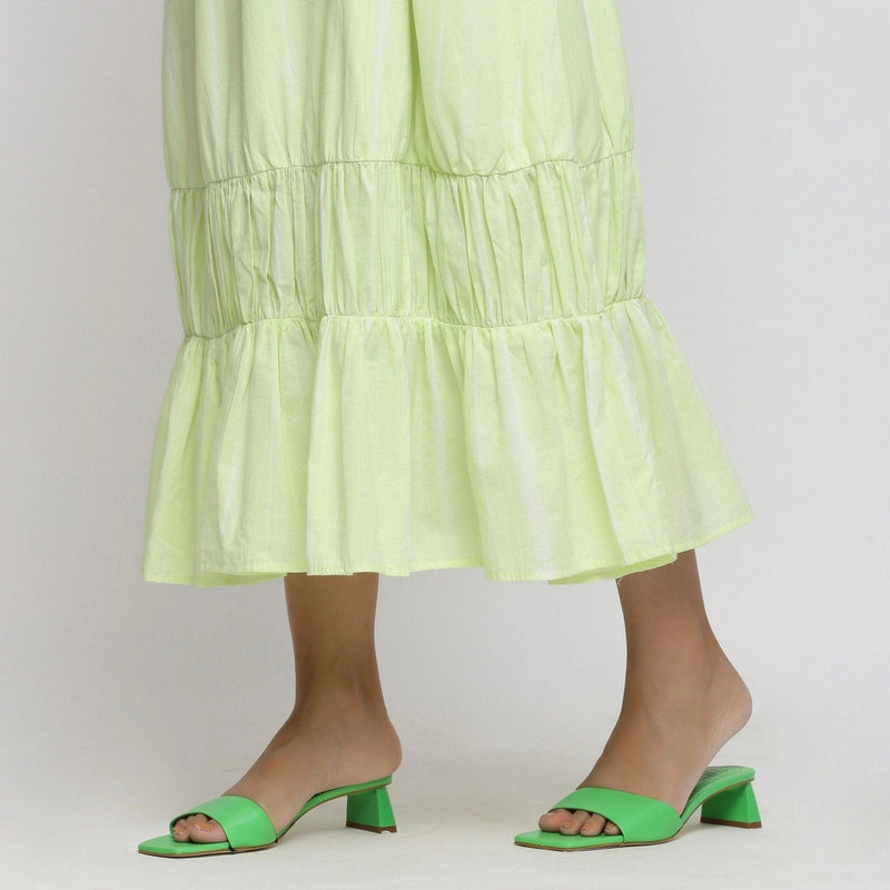 Left View of a Model wearing Mint Green Tie and Dye Tiered Dress