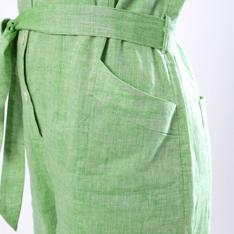 Left Detail of a Model wearing Handspun Mint Green Paneled Button-Down Jumpsuit