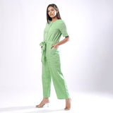 Left View of a Model wearing Handspun Mint Green Paneled Button-Down Jumpsuit