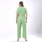 Back View of a Model wearing Handspun Mint Green Paneled Button-Down Jumpsuit