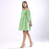 Left View of a Model wearing Handspun Mint Green Off-Shoulder Dress