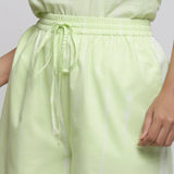 Front Detail of a Model wearing Mint Green Tie & Dye Bermuda Shorts