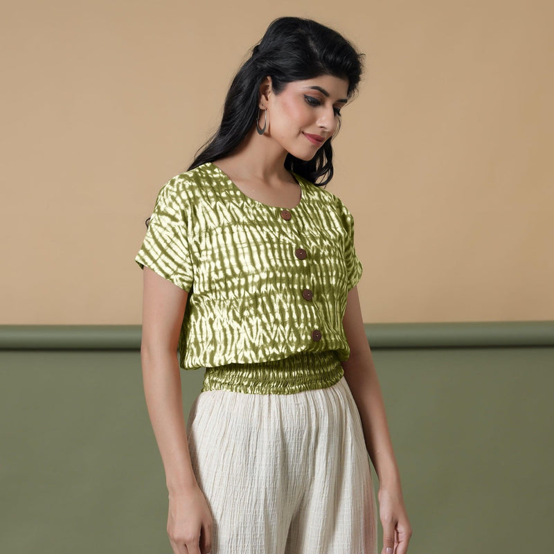 Right View of a Model wearing Olive Green Shibori Button-Down Blouson Top