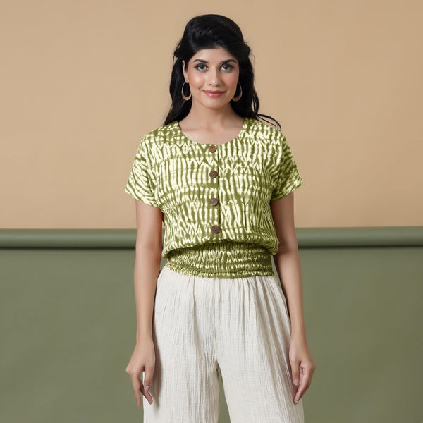 Front View of a Model wearing Olive Green Shibori Button-Down Blouson Top