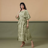 Left View of a Model wearing Light Green Shibori Kaftan Dress