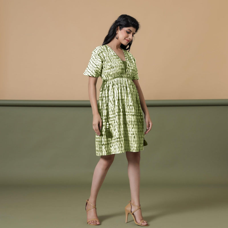 Right View of a Model wearing Olive Green Shibori Drop Shoulder Dress