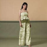 Right View of a Model wearing Olive Green Shibori Paperbag Cotton Pant