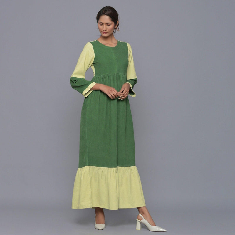 Front View of a Model wearing Moss Green Corduroy Tier Gathered Dress