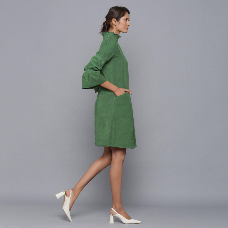 Right View of a Model wearing Moss Green Corduroy High Neck Dress