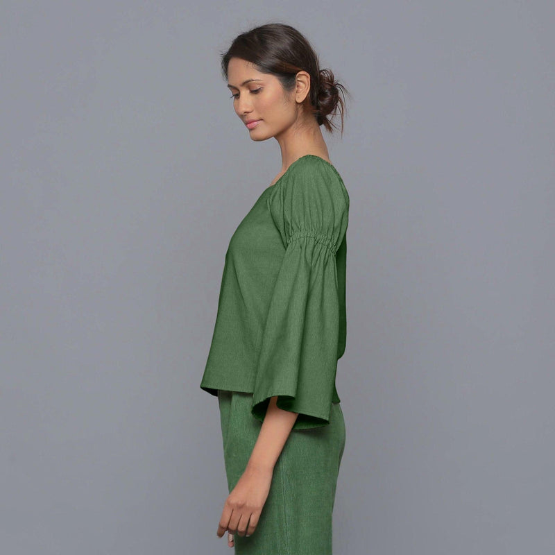 Left View of a Model wearing Moss Green Pistachio Corduroy Bohemian Top