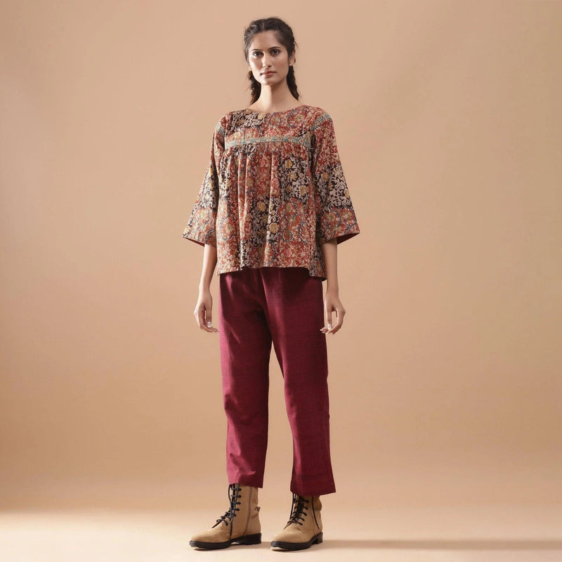 Front View of a Model wearing Muddy Red Block Print Cotton Kalamkari Top