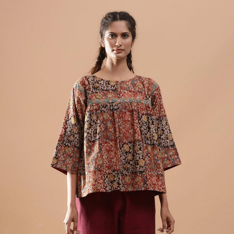 Front View of a Model wearing Muddy Red Block Print Cotton Kalamkari Top