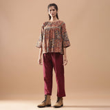 Front View of a Model wearing Muddy Red Kalamkari Flannel Floral Top