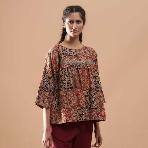 Front View of a Model wearing Muddy Red Kalamkari Flannel Floral Top