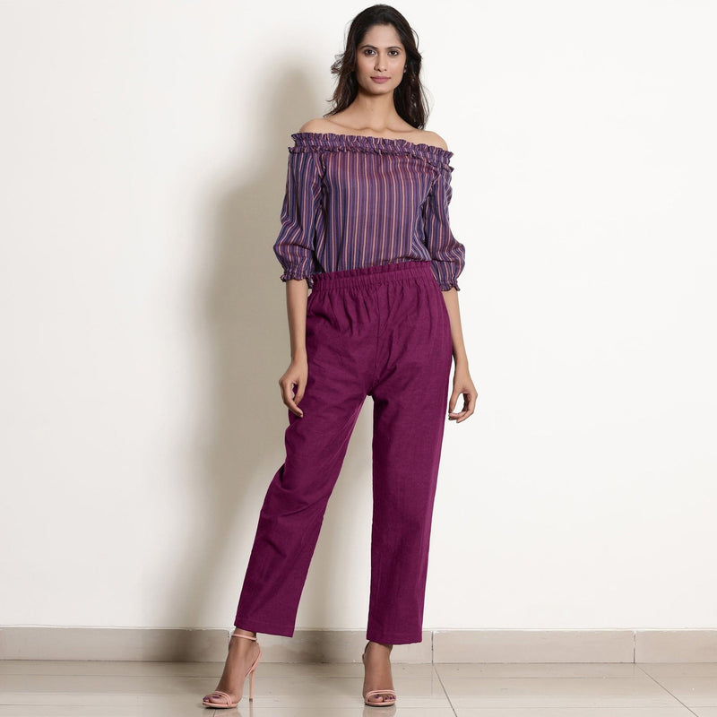 Front View of a Model wearing Warm Mulberry Frilled Waist Tapered Cotton Pant