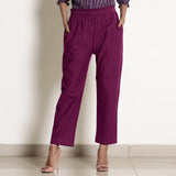 Front View of a Model wearing Warm Mulberry Frilled Waist Tapered Cotton Pant