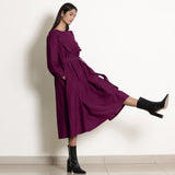 Right View of a Model wearing Warm Mulberry 100% Cotton Frilled Yoke Dress