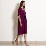 Right View of a Model wearing Warm Mulberry Loose Fit Cotton Jumpsuit