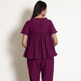 Back View of a Model wearing Mulberry Gathered Frilled Cotton Top
