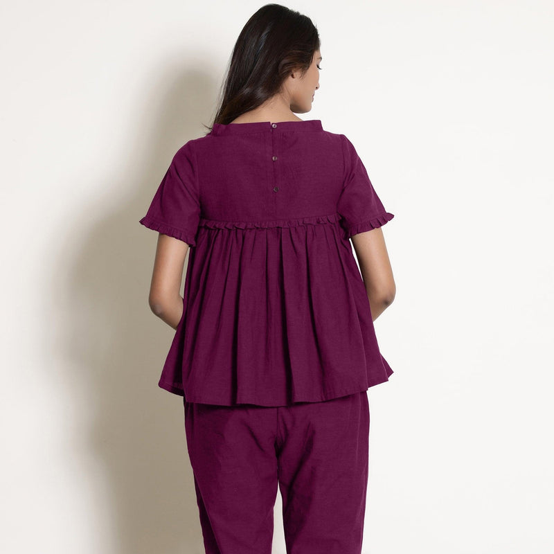 Back View of a Model wearing Mulberry Gathered Frilled Cotton Top