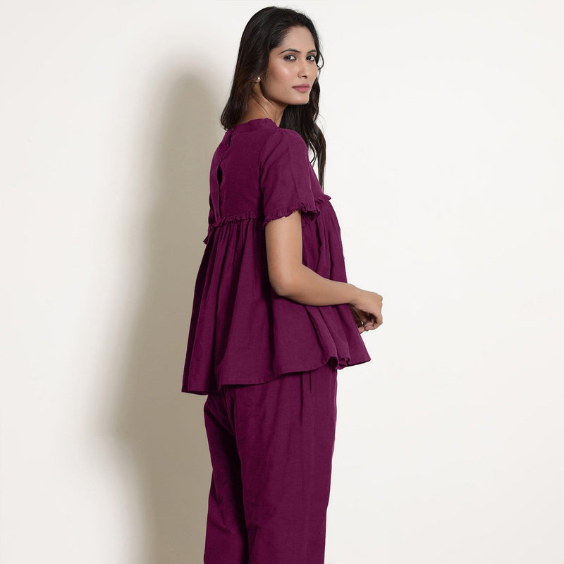 Back View of a Model wearing Mulberry Gathered Frilled Cotton Top