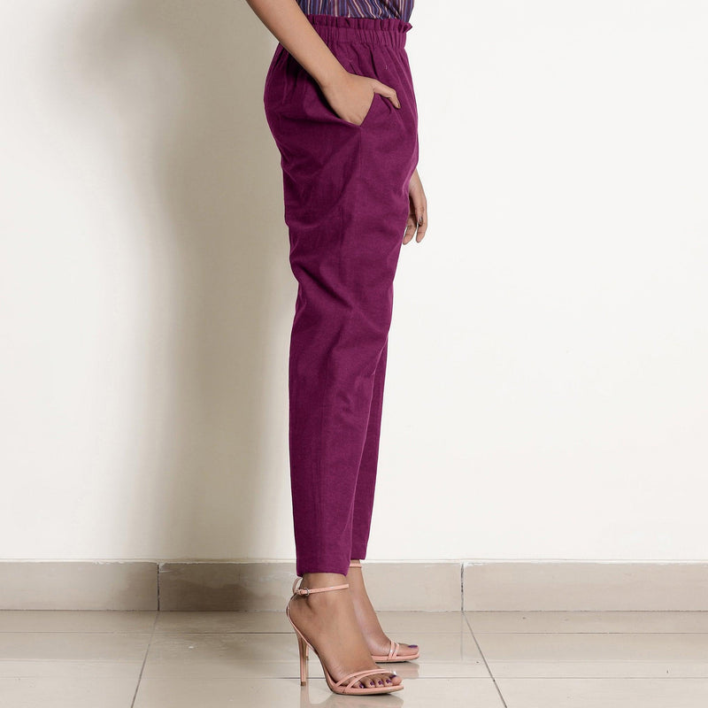 Right View of a Model wearing Warm Mulberry Frilled Waist Tapered Cotton Pant