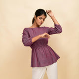 Front View of a Model wearing Mulberry Yarn-Dyed 100% Cotton Peplum Top