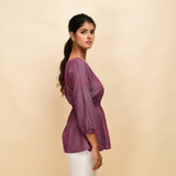 Right View of a Model wearing Mulberry Yarn-Dyed 100% Cotton Peplum Top