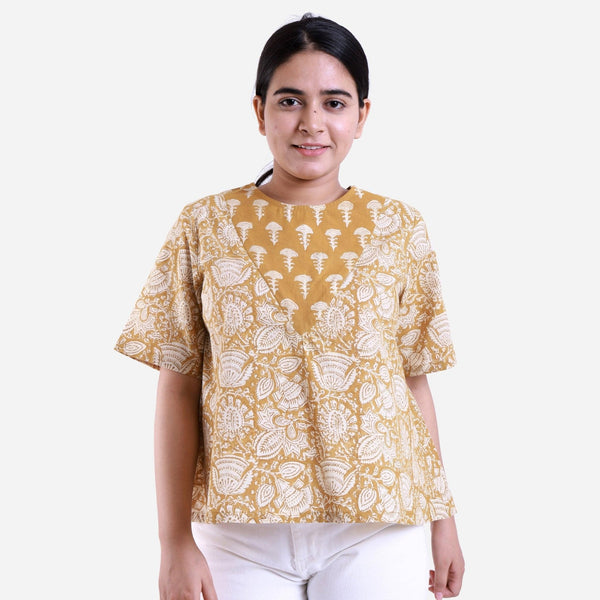 Front View of a Model wearing Mustard Bagru Printed Flared Top