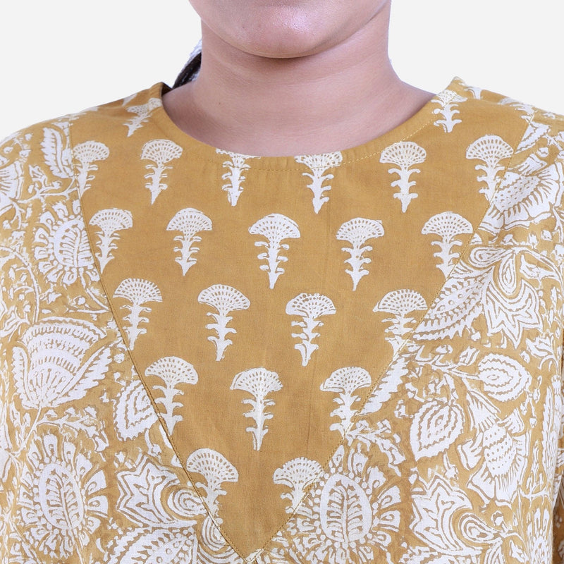 Front Detail of a Model wearing Mustard Bagru Printed Flared Top