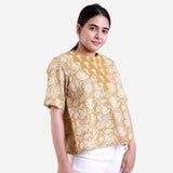 Right View of a Model wearing Mustard Bagru Printed Flared Top